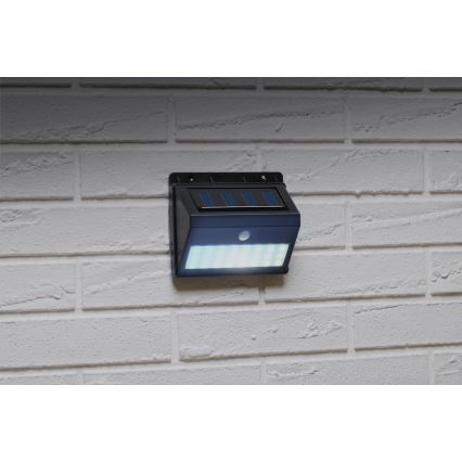 Grundig - Aplică solară de perete cu LED și senzor, 1,2V 600 mAh, IP44