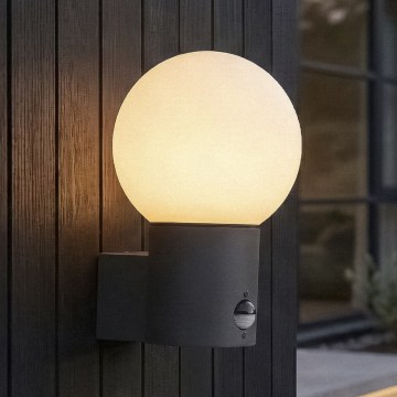 Lampă de perete pentru exterior cu senzor de mișcare și de crepuscul STONO 1xE27/15W/230V IP65 antracit