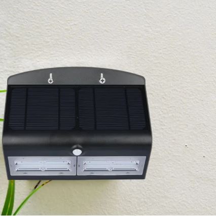 Lumină solară LED de perete cu senzor LED/7W/3,7V 4000K IP65 4000 mAh negru