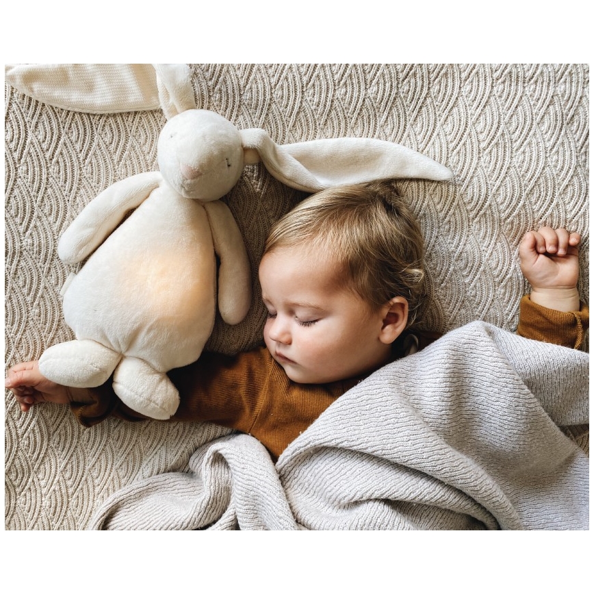 Pluș de îmbrățișat cu sunete și lumină Moonie iepuraș 2.0 cream