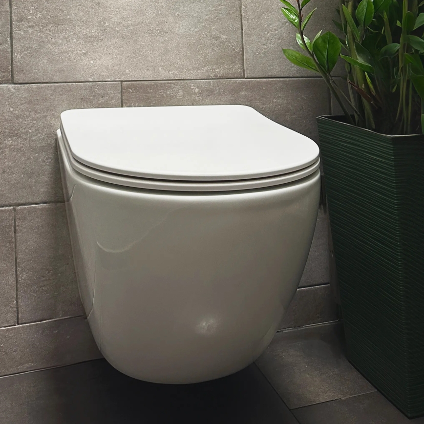 REA-C1259 - Vas WC suspendat cu capac CARLO MINI TORNADO RIMLESS, ceramică/alb lucios